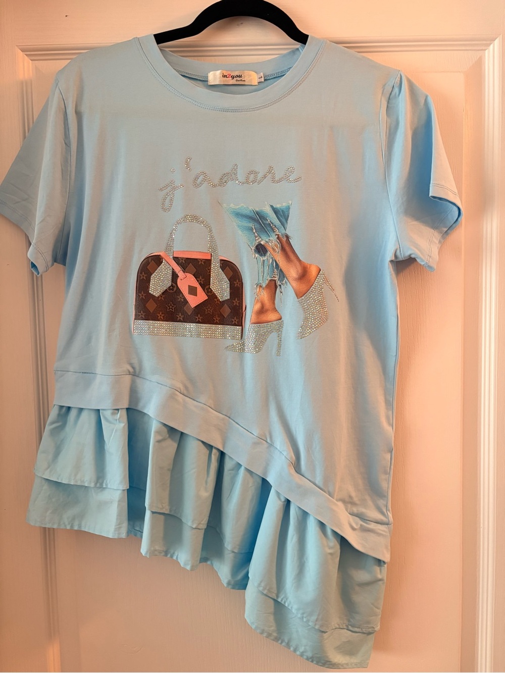 Light Blue Ruffle-Hem Tee with Sparkle Handbag Graphic with asymmetrical peplum